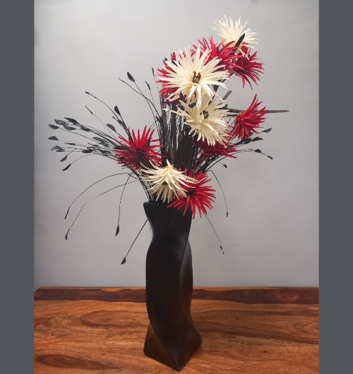 Black Vase With Red And White Flowers